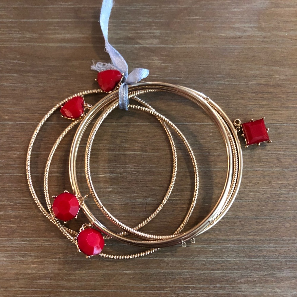 6 Gold Colored Bracelets / Some with red charms